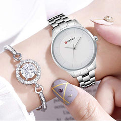 CURREN Elegant Design Women's Watch, Shiny Hands, Minimalist Dial with Adjustable Stainless Steel Band with Butterfly Clasp for Safety, silver with white, M, Casual