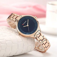 CURREN Elegant Design Women's Watch, Shiny Hands, Minimalist Dial with Stainless Steel Extendable Adjustable Strap with Butterfly Clasp for Safety, Blue with Gold, M, Casual