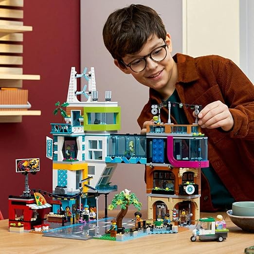 LEGO 60380 City City Centre Set, Model Building Kit with Reconfigurable Modular Rooms including Toy Shops, Barber, Vlogger Studio, Hotel and Rooftop Disco with 14 Minifigures