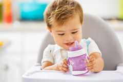 Munchkin Gentle Transition Trainer Cup, Spout transition from bottle to spill proof cup, leak proof and anti-slip handle for Baby/infant, boys and girls, 4oz Capacity, 4 months and above, Purple