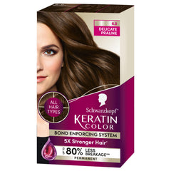 Schwarzkopf Keratin Color Permanent Hair Dye 6.0 Delicate Praline, a professionally inspired permanent hair dye, for up to 80% less breakage than untreated hair and up to 100% gray coverage.